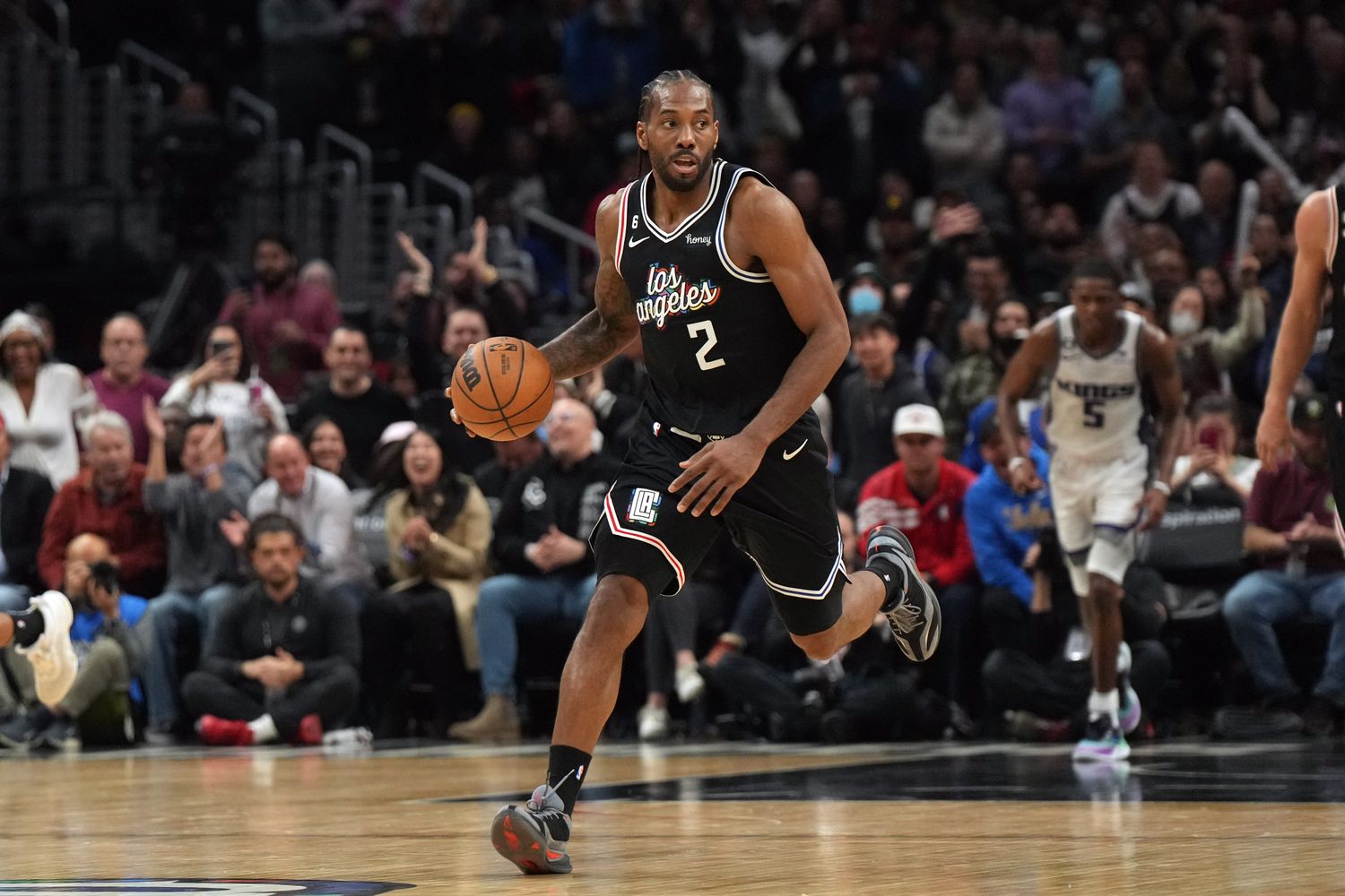 Los Angeles Clippers forward Kawhi Leonard dribbles the ball against the Sacramento Kings.
